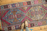 Distressed Oushak runner's stepped medallion and border in bubble gum pink and pale slate blue.