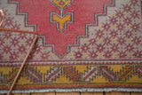 Low pile serrated leaf main border in saffron yellow and pale raspberry red.