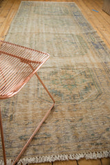 Distressed vintage Oushak runner pile with mostly even wear to knot heads and secured fringe.