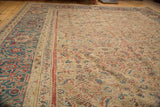 Antique Mahal carpet featuring classic Herati field motif and sky blue gem tone border.
