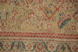 Textured pile of Antique Mahal carpet, showing herati motif and a cherry red patterned border.