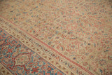Diagonal view of antique Persian Mahal carpet, herati motif field meeting gem tone border.