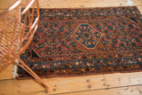 Secured long edge and patterned sky blue border of a vintage Engelas rug.