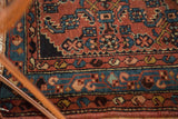 Vintage Engelas rug's traditional border and Herati pattern in brick red and blue.