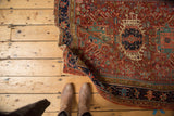 Finely woven antique Karaja rug corner, featuring serrated motifs in brick red and navy.