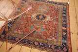 Antique Karaja rug corner, intricate geometric patterns, navy border, and tattered end.