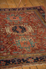 Finely woven antique Karaja rug with serrated geometric motifs, central medallion, subtle wear, rich red and navy.