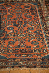 Persian Fine Hamadan rug displaying brick red Herati motif, floral vine border, and light tinted fringe.