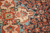 Textured close-up of vintage Malayer rug with floral quatrefoil and herati motifs.
