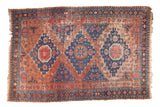 Antique Soumac carpet, triple medallions, red and blue tones, aged patina, 8'8