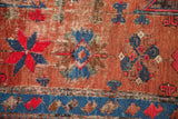 Antique Soumac Carpet detail showcasing geometric motifs in madder red and indigo with deep pile wear.