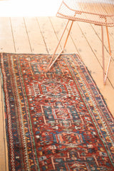 Detailed Karaja rug pattern with cherry red field, diverse hues, and secure side cord selvage.