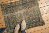 Worn antique Caucasian Chi Chi rug with paneled medallion field and sky blue starburst border.