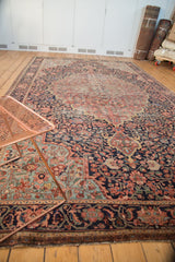 Antique Farahan Sarouk rug detail, featuring curvilinear borders and navy millefleur field.