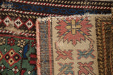 Detail of antique Caucasian rug's professionally seamed foundation and geometric pile.