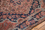 Vintage Josan Sarouk rug: navy border's meandering vine, brick red field, intricate floral vinery.