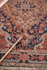 Vintage Josan Sarouk rug: rococo spandrels, meandering border, navy, brick red.