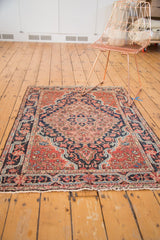 Josan Sarouk rug lower corner, intricate floral vinery, classic meandering border, tattered fringe.