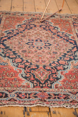 Josan Sarouk rug main border, classic meandering vine, brick red, navy blue, with light tatter.