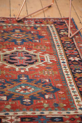 Vintage Karaja rug: red and navy geometric patterns, colorful beaded border, even wear.