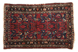 Vintage Lilihan rug, allover raspberry red field with indigo blue and ivory floral arabesques.