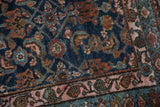 Vintage Hamadan rug detail: Herati motif on indigo field, bronze and pale blush border.