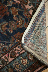 Tightly woven foundation and dark indigo Herati pile of a vintage Hamadan rug.