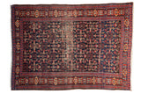 Vintage Senneh rug with allover Herati design, indigo field, madder red trident border, and center wear.