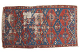 Antique Shirvan rug, late 19th century, displaying geometric red and blue diamonds with visible wear, 4'4