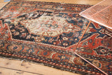 Antique Northwest Persian geometric border, madder red, navy blue, with prominent foundation wear.
