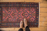 Dusty rose field of vintage Lilihan rug with serrated herati leaves and cobalt border.