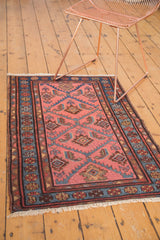 Vintage Lilihan rug detail, showing dusty rose field with lattice diamonds and serrated herati leaves.