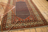 Antique Persian Malayer rug corner; rust floral spandrel with sharp serrated ivory border.