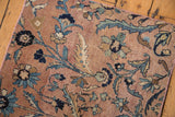 Antique Kerman runner detail: Scrolling blue palmettes and vinery on sand, hand bound pink selvage.