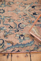 Antique Persian Kerman fragment with hand bound selvage, even wear, and floral palmette motif.