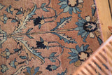 Persian Kerman fragment's scrolling vinery, floral palmettes, hand-bound selvage, even pile wear.