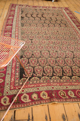 Ornate red borders and staggered boteh pattern on a late 19th century Karabagh carpet.