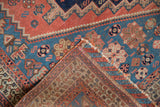 Antique Afshar rug's folded corner reveals its tightly woven foundation and tattered edge.