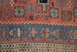 Densely woven geometric floral motifs and borders of an antique Afshar rug.