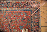 Vintage Heriz rug border detail, navy samovar motif, brick red field, floral minors.
