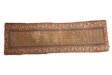 Antique Kurdish runner rug with allover field of germinating plants, warm reds, pale gold, blue.