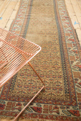 Antique Persian Kurdish runner with allover germinating plant pattern, red, gold, blue geometric borders.
