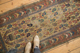 Antique Caucasian prayer runner detail: dusty gold field, staggered germinating boteh pattern, Laleh Abassi border.