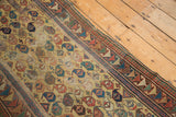 Antique Caucasian runner corner with dusty gold boteh field, arrowed, and Laleh Abassi borders.