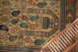 Antique Caucasian prayer rug's comb design, staggered boteh motifs, and arrowed border.