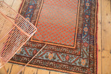 Hamadan runner with abrash-filled blush and silver lattice field, featuring intricate meandering vine border.