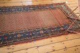 Vintage Hamadan runner, displaying visible end tatter, abrash, and blue palmette borders.