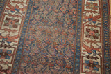 Antique Kurdish Bijar rug detail: worn indigo field with botehs and avian-motif primary border.