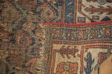 Hard wear and exposed foundation on an antique Kurdish Bijar rug with tattered end.