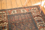 Corner detail of Antique Kurdish Bijar rug: tattered fringe, earthy geometric border, muted indigo field.